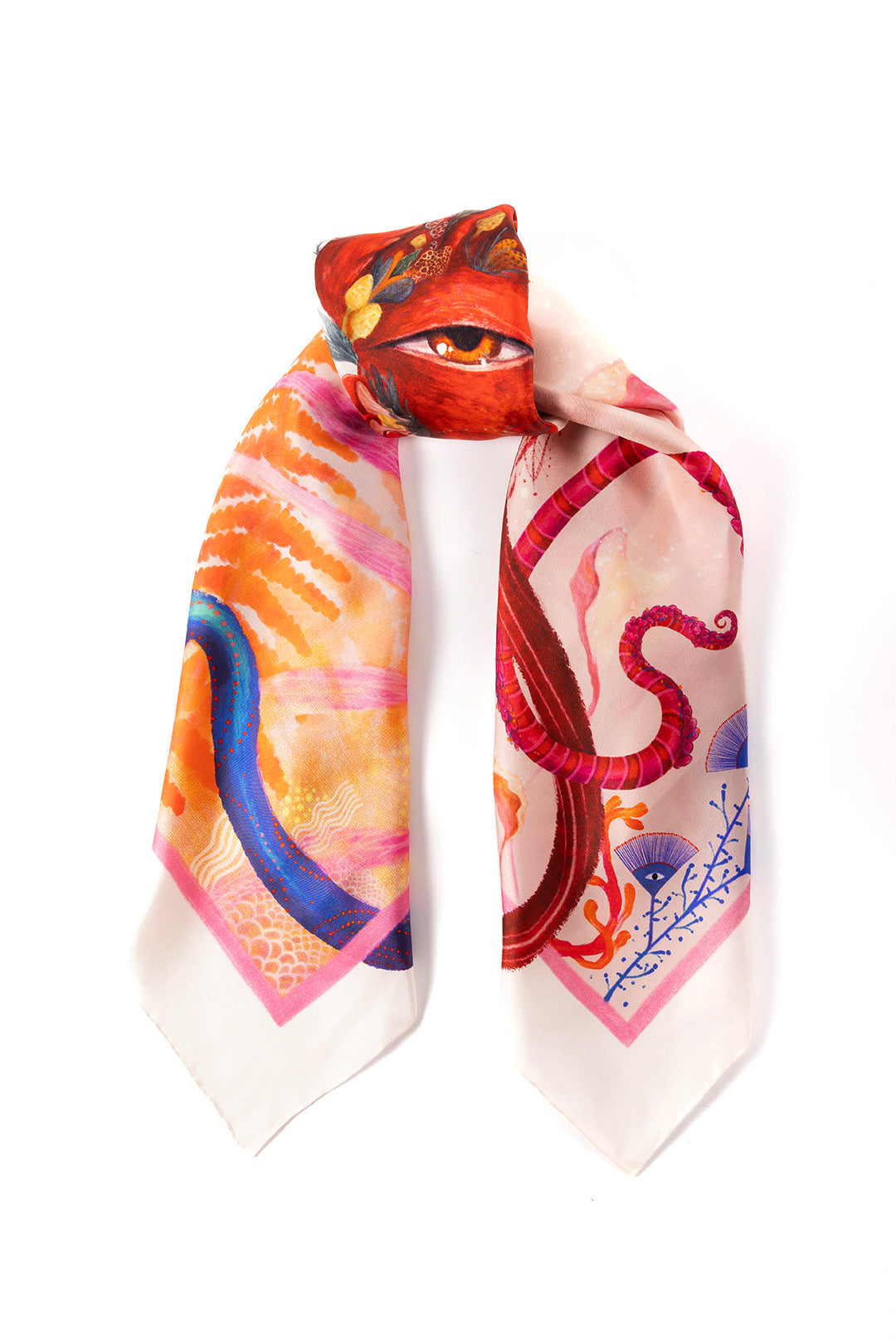 The silk scarf folded vertically to emphasize the central flaming heart and eye graphic, with the patterned ends hanging downward.