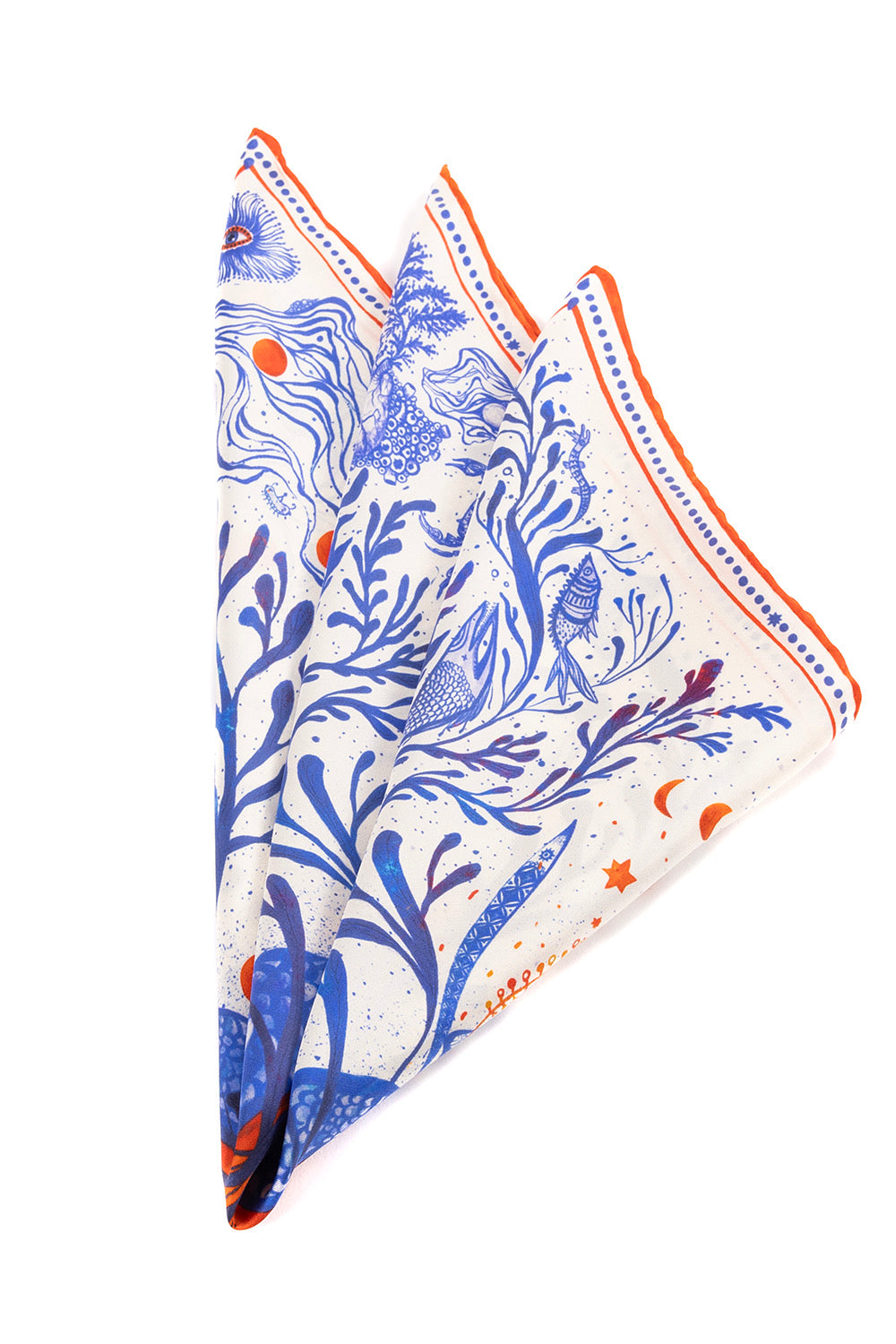 Folded square silk scarf showcasing intricate blue artistic illustrations.