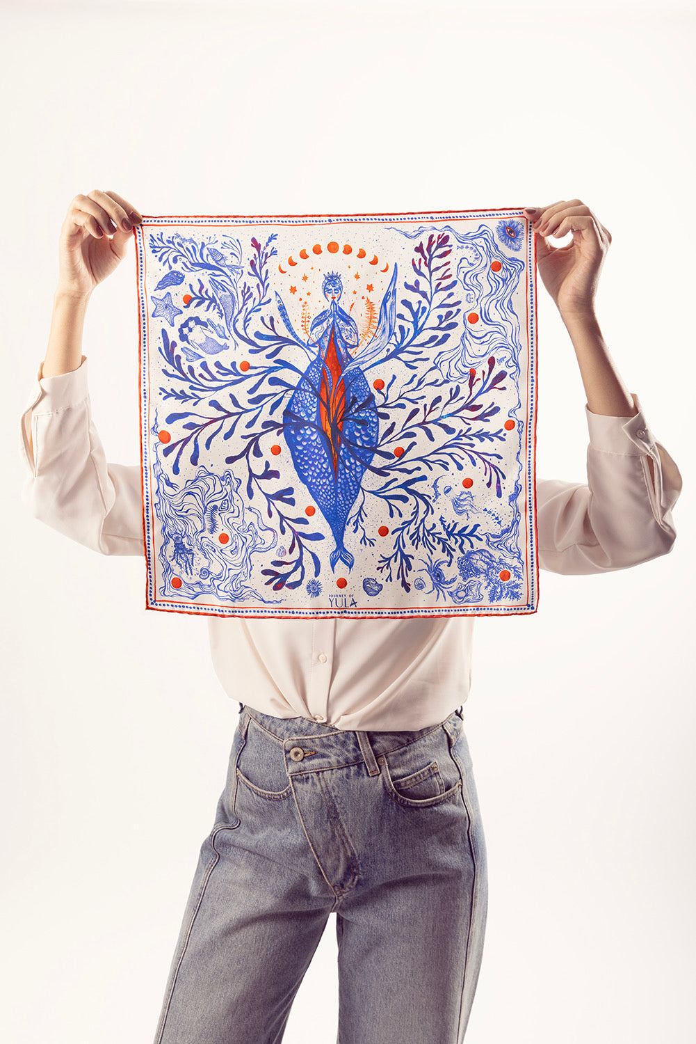 Full view of square silk scarf featuring mermaid and moon phase illustrations.
