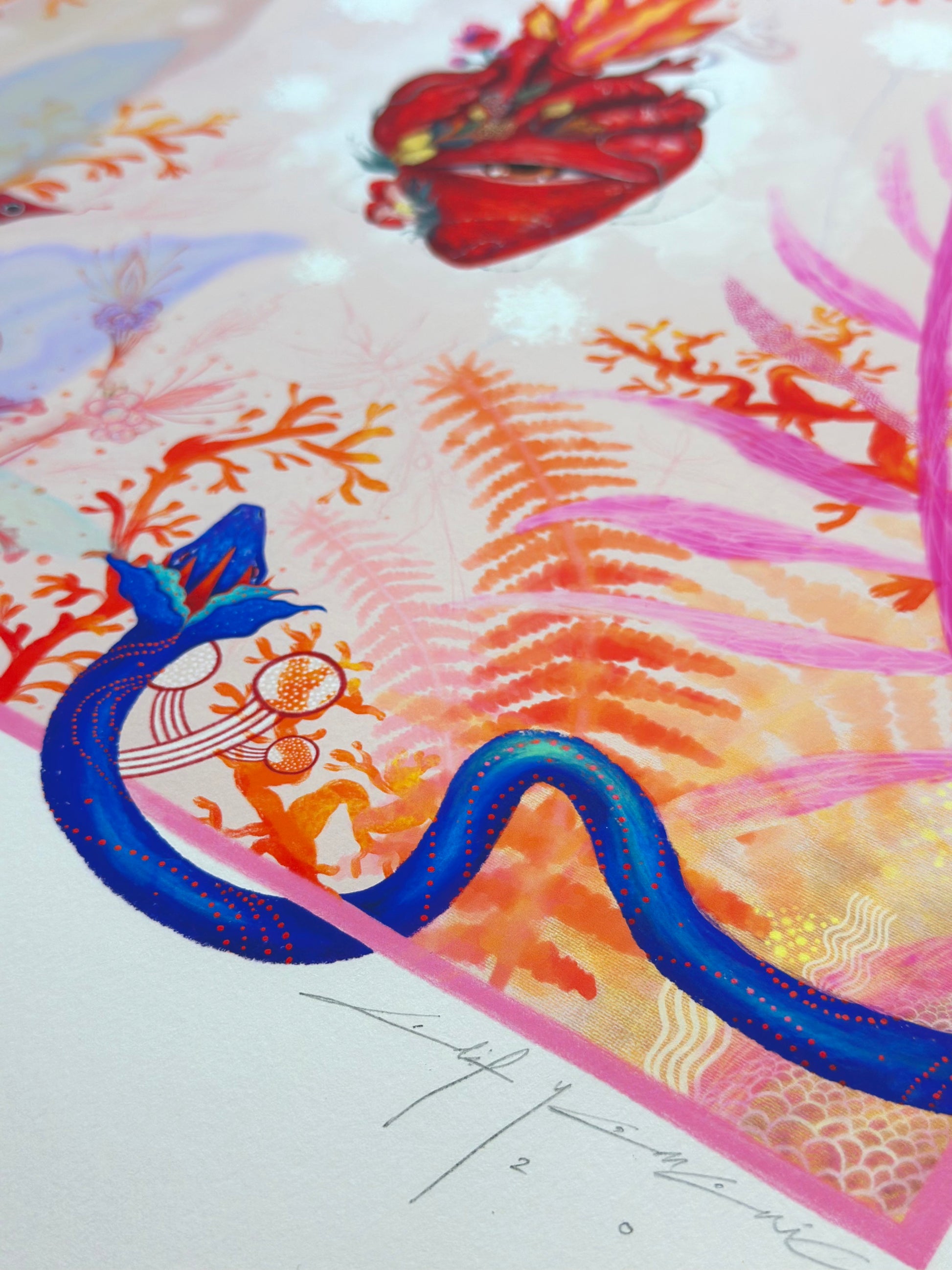 Close-up detail of "Heart Aflame" art print showing a blue snakeand delicate pastel botanical illustrations on high-quality paper and signature of artist